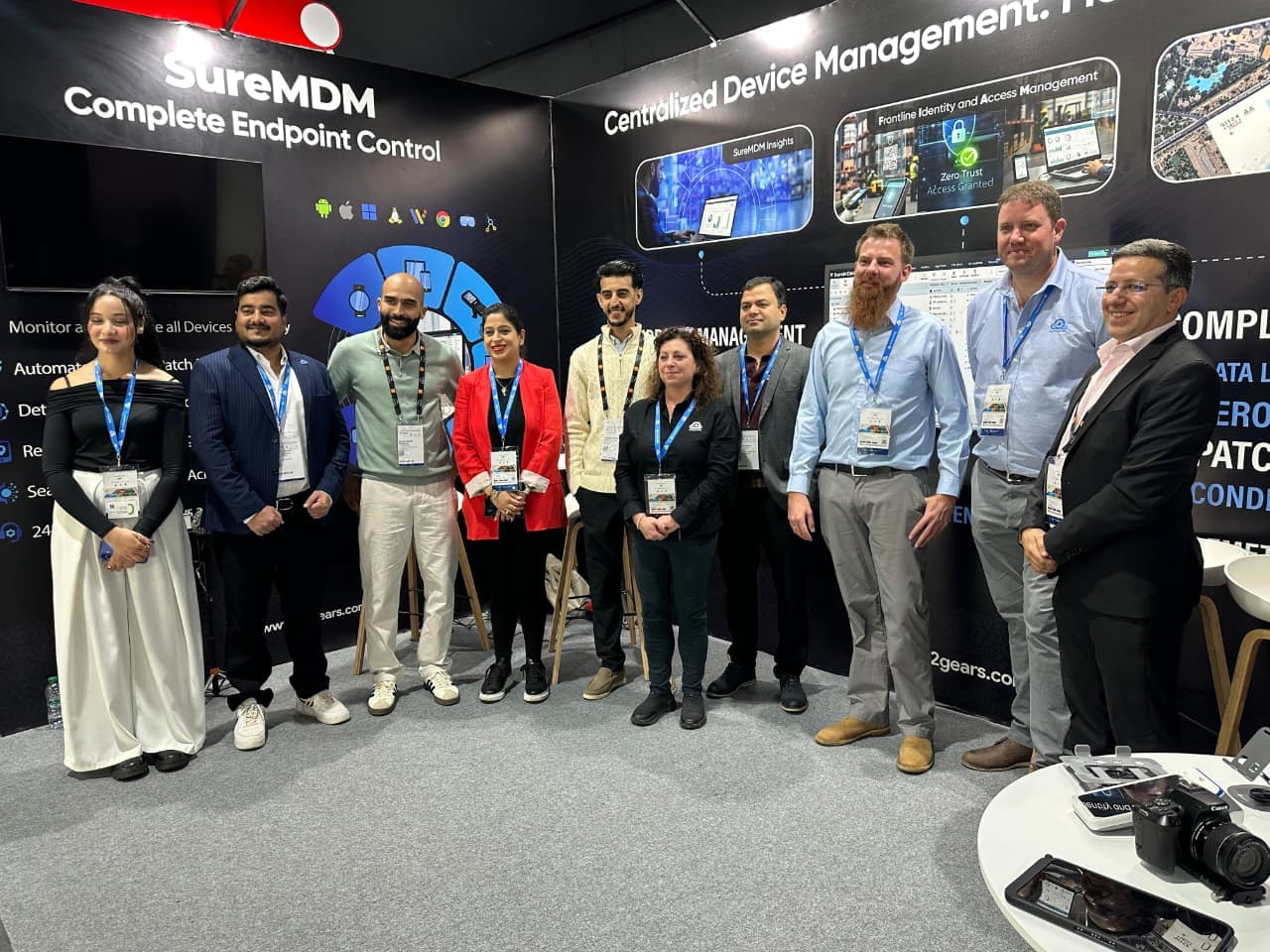 Group photograph at a SureMDM exhibition stand