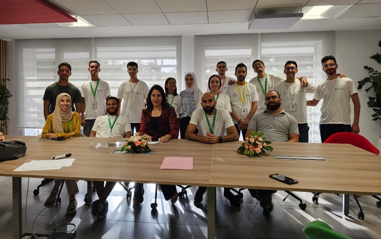 Group photograph with the EMSI hackathon community